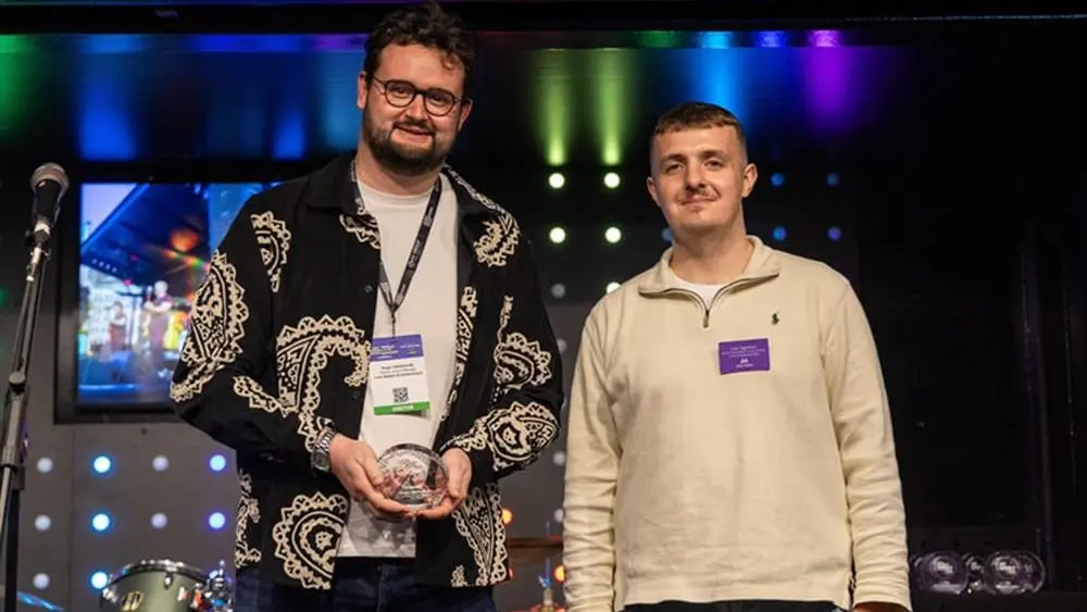 (l-R) Hugo receiving his 30 under 30 award from Gus, Marketing Director for Access All Areas