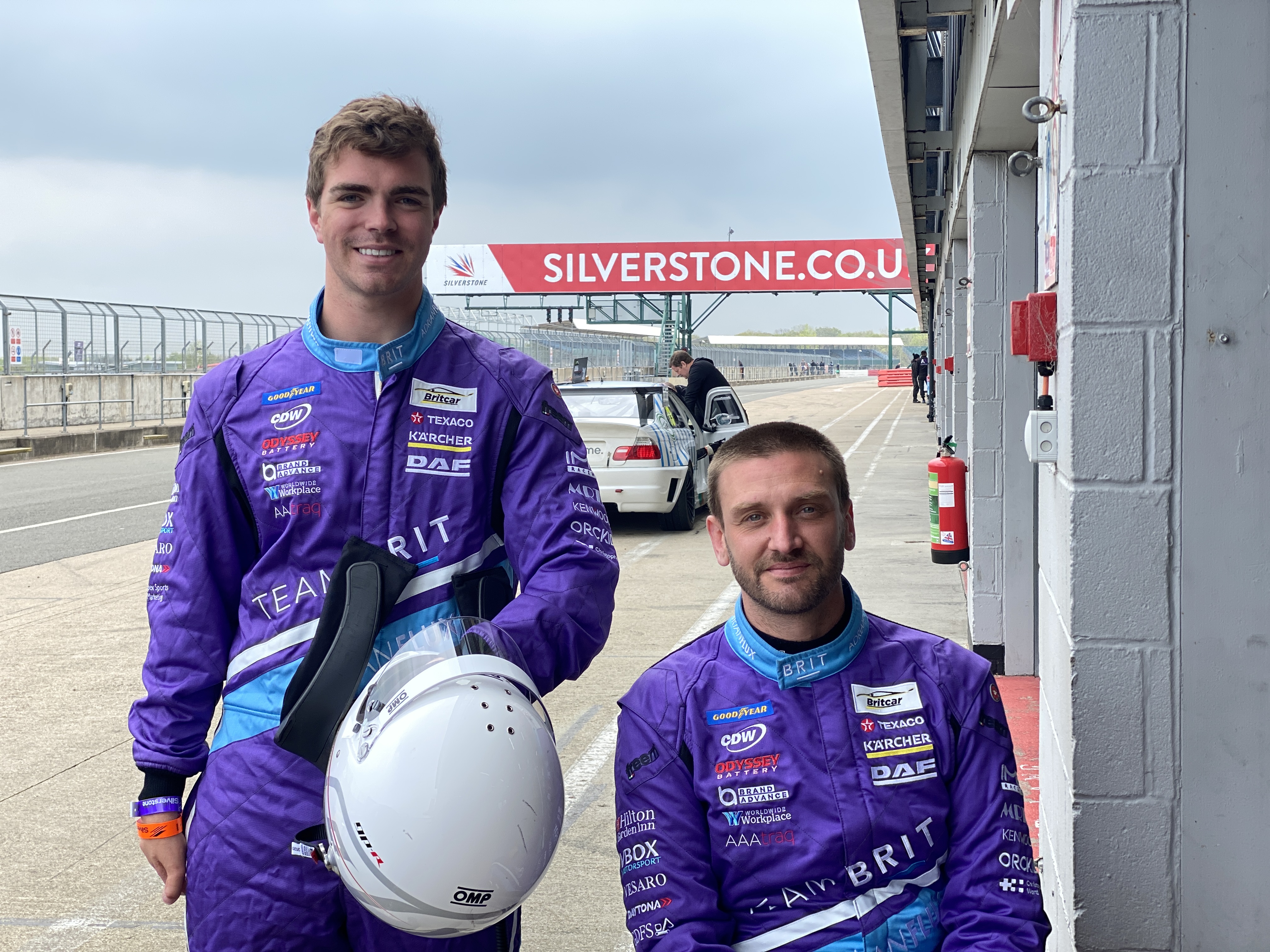Image shows Chris Overend and another racing driver at Silverstone circuit