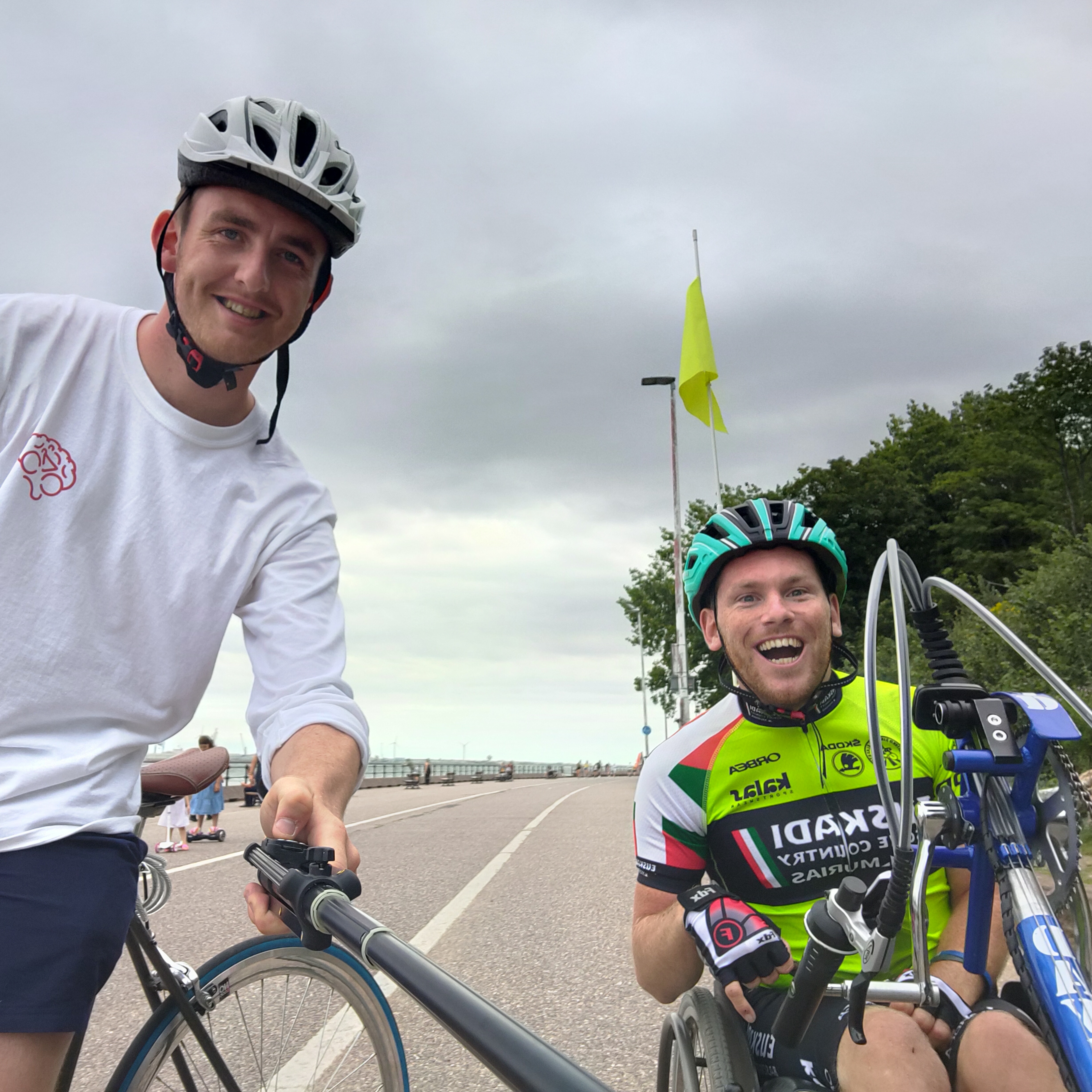 Picture of Harrison and his friend on a handcycle