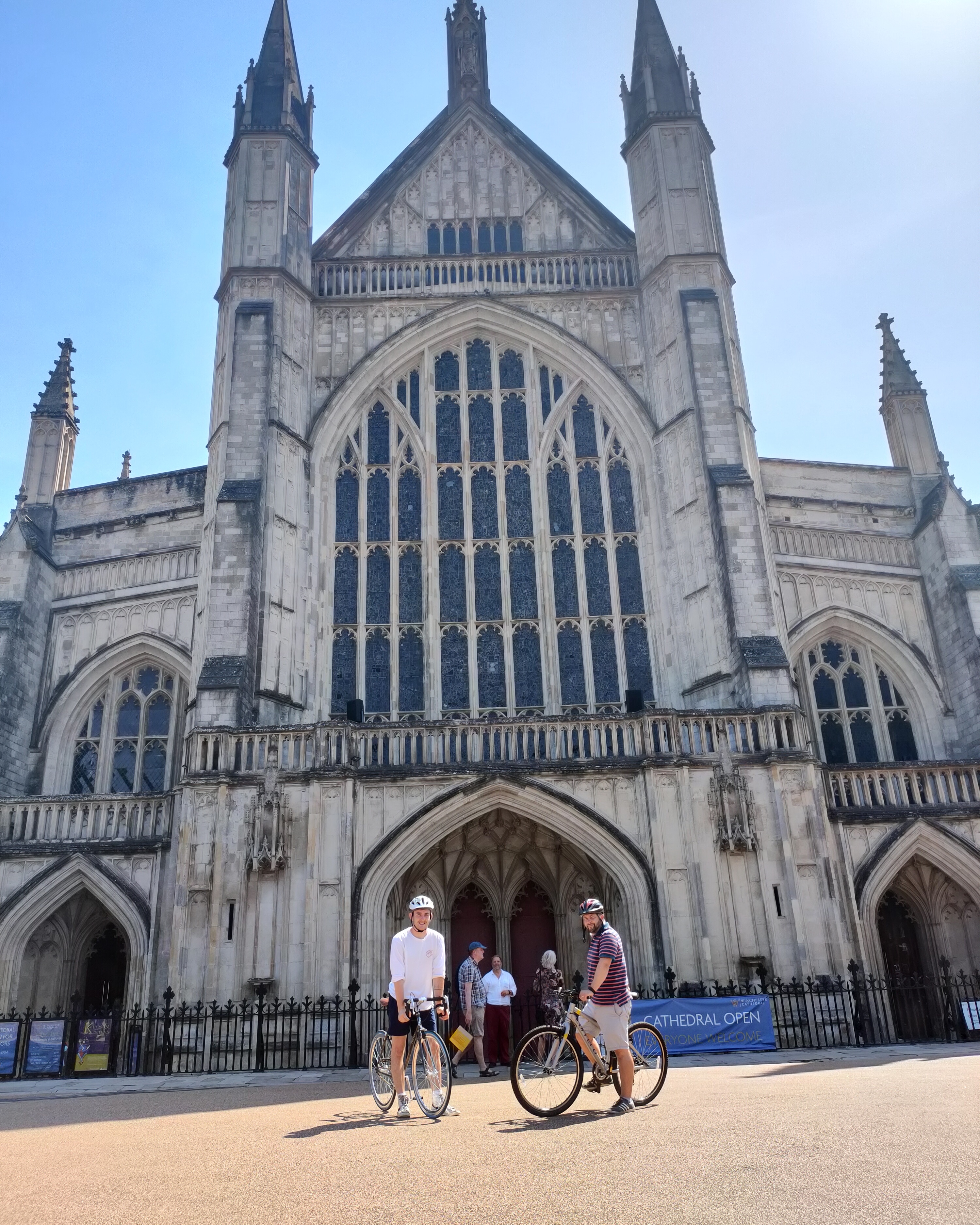 Picture of Harrison on a bike outside Winchester Cathedral 