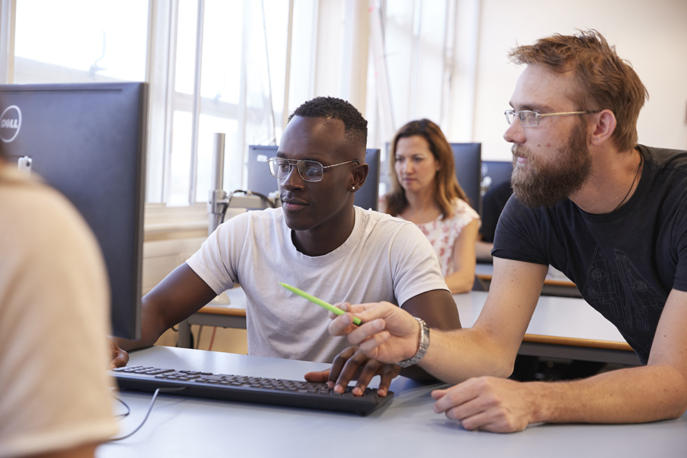 Picture of two computing students in discussion 