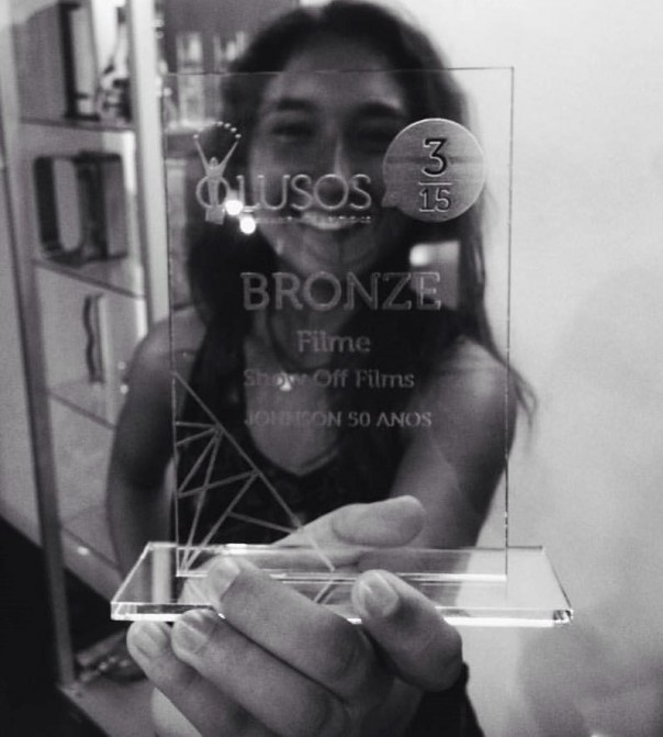 Carlota holding an award