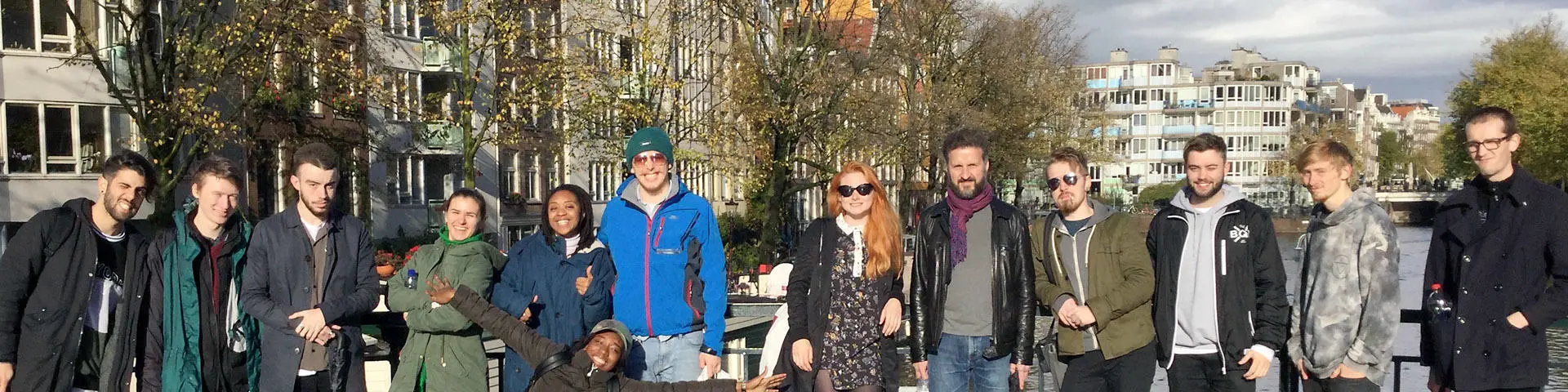 Solent's music students on a bridge over a canal in Amsterdam