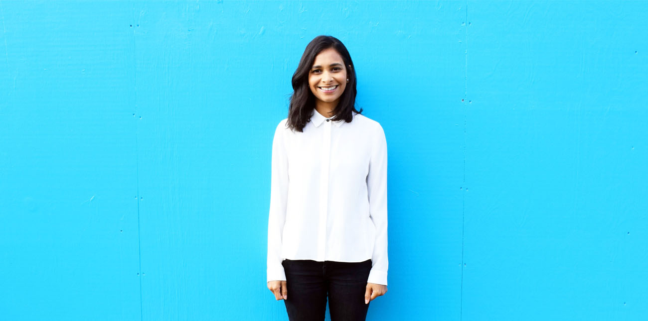A picture of Anushka Fernando on a blue background.