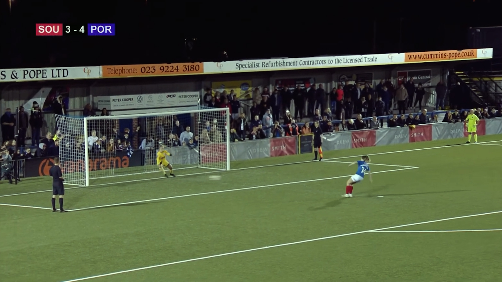 image of Portsmouth football player kicking the ball into the Southampton goal