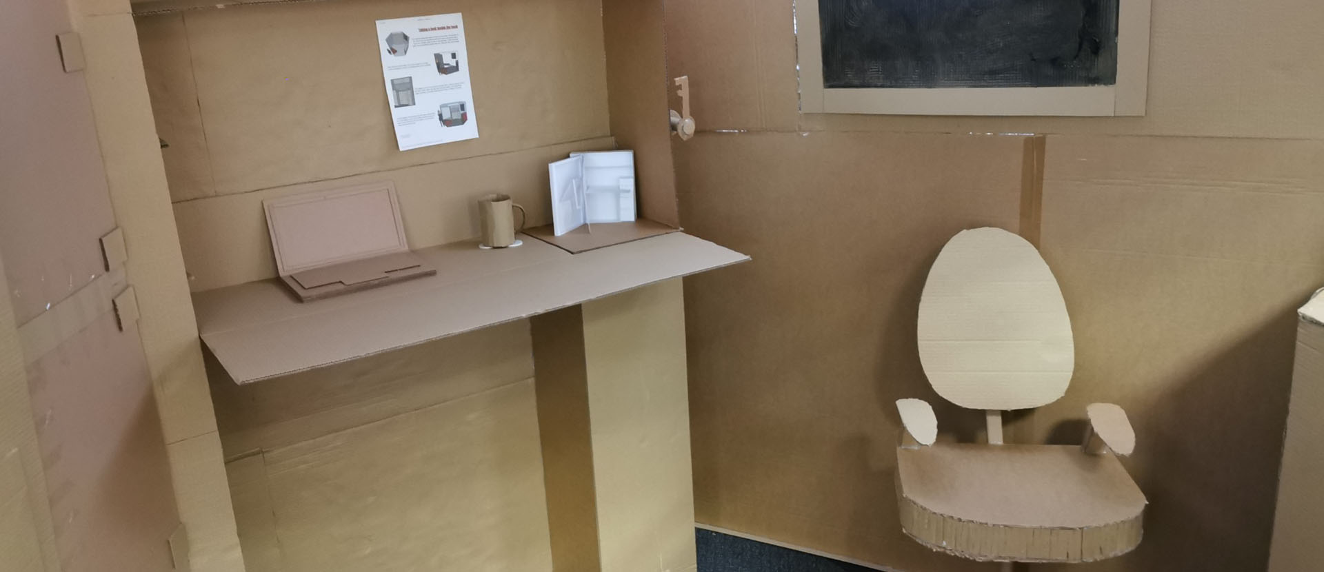 Picture of inside of Cabana Banana's beach hut featuring card chair, desk and cups
