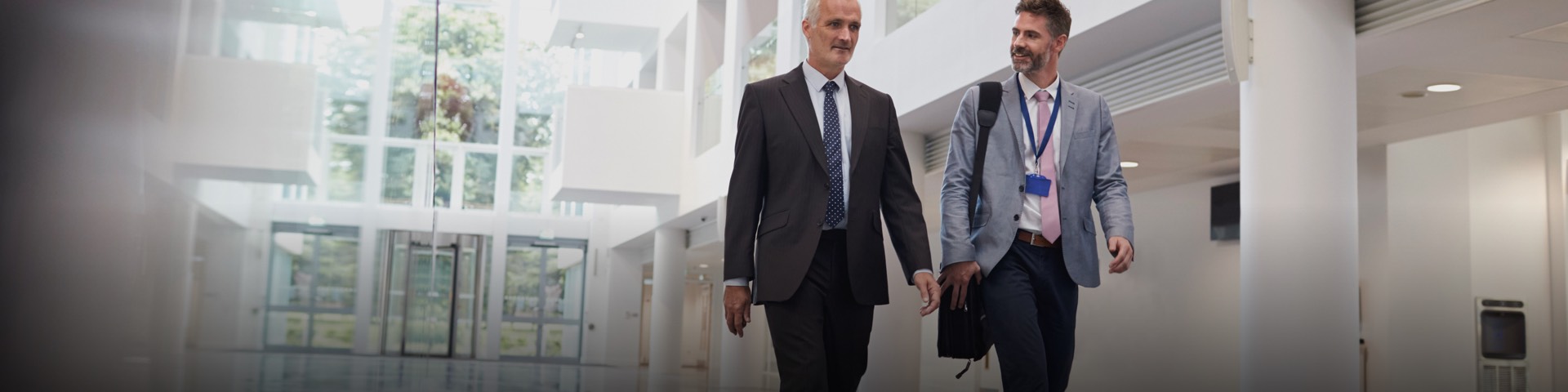 Two male mature students walking through The Spark