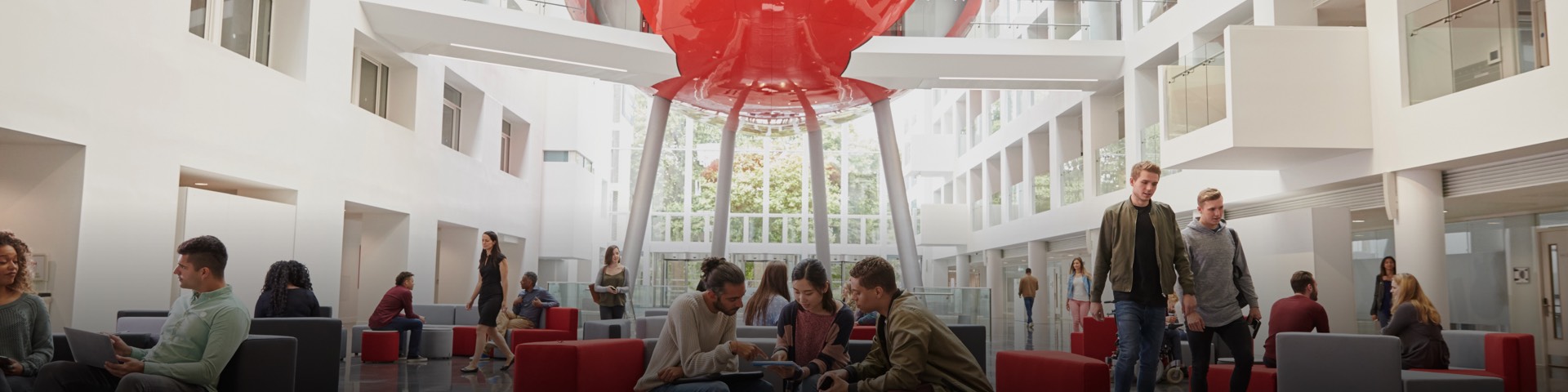 Students in The Spark with the Pod in the background