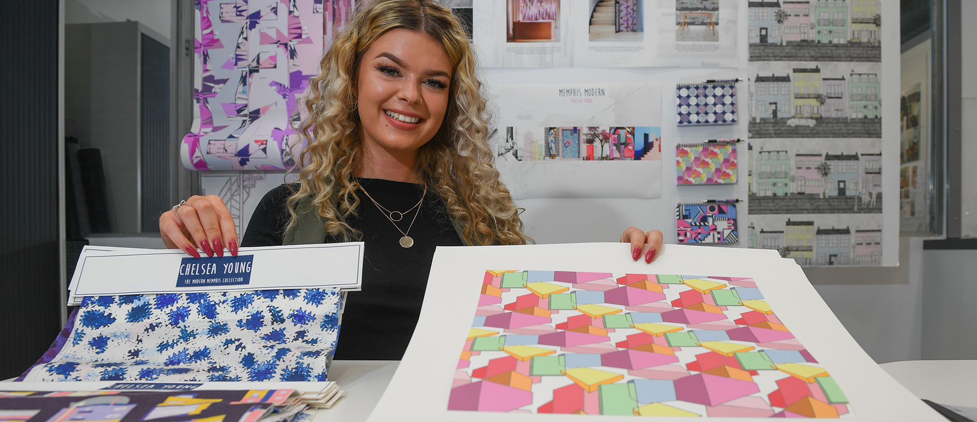 Chelsea Young with some of the furnishing fabrics she designed