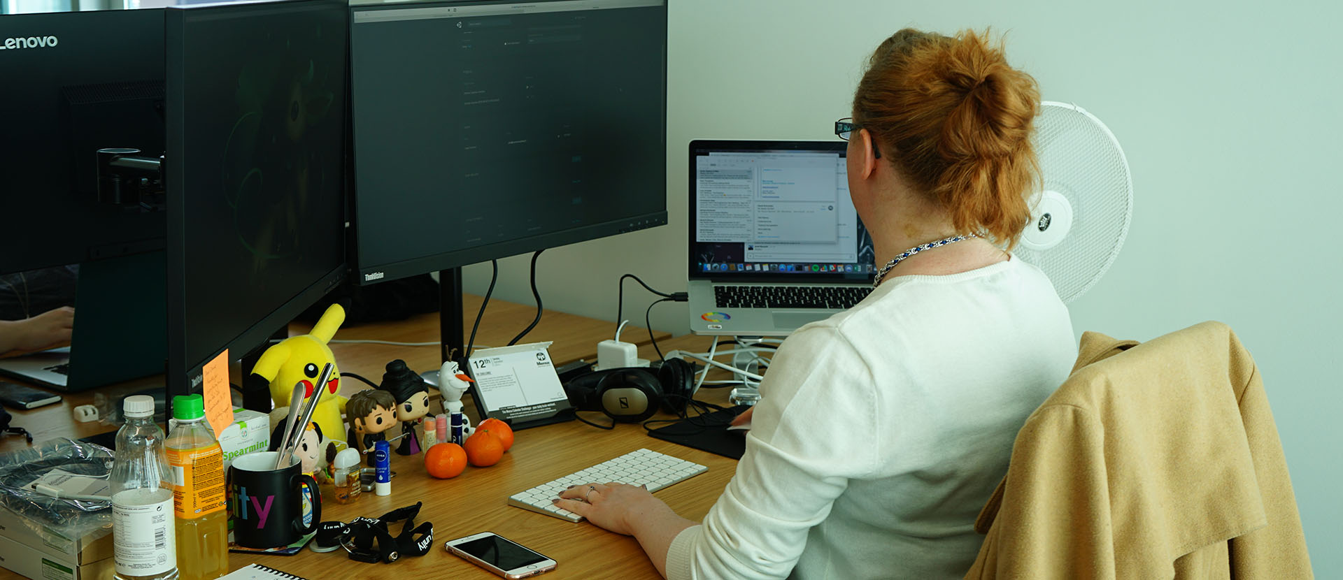 Solent alum, Claire Oliver, working on her laptop
