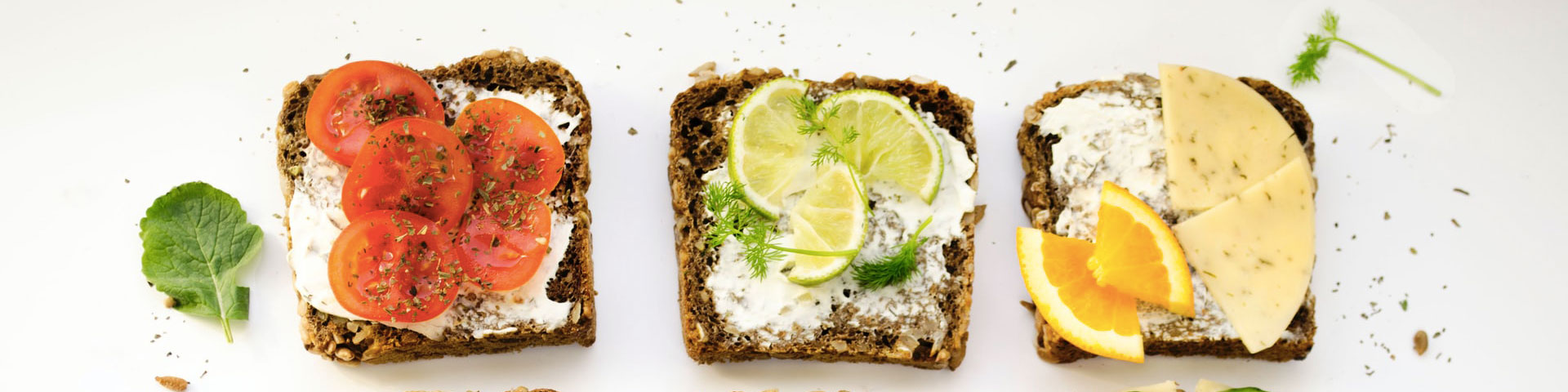 A range of healthy foods, including tomatoes, brown toast and fruit
