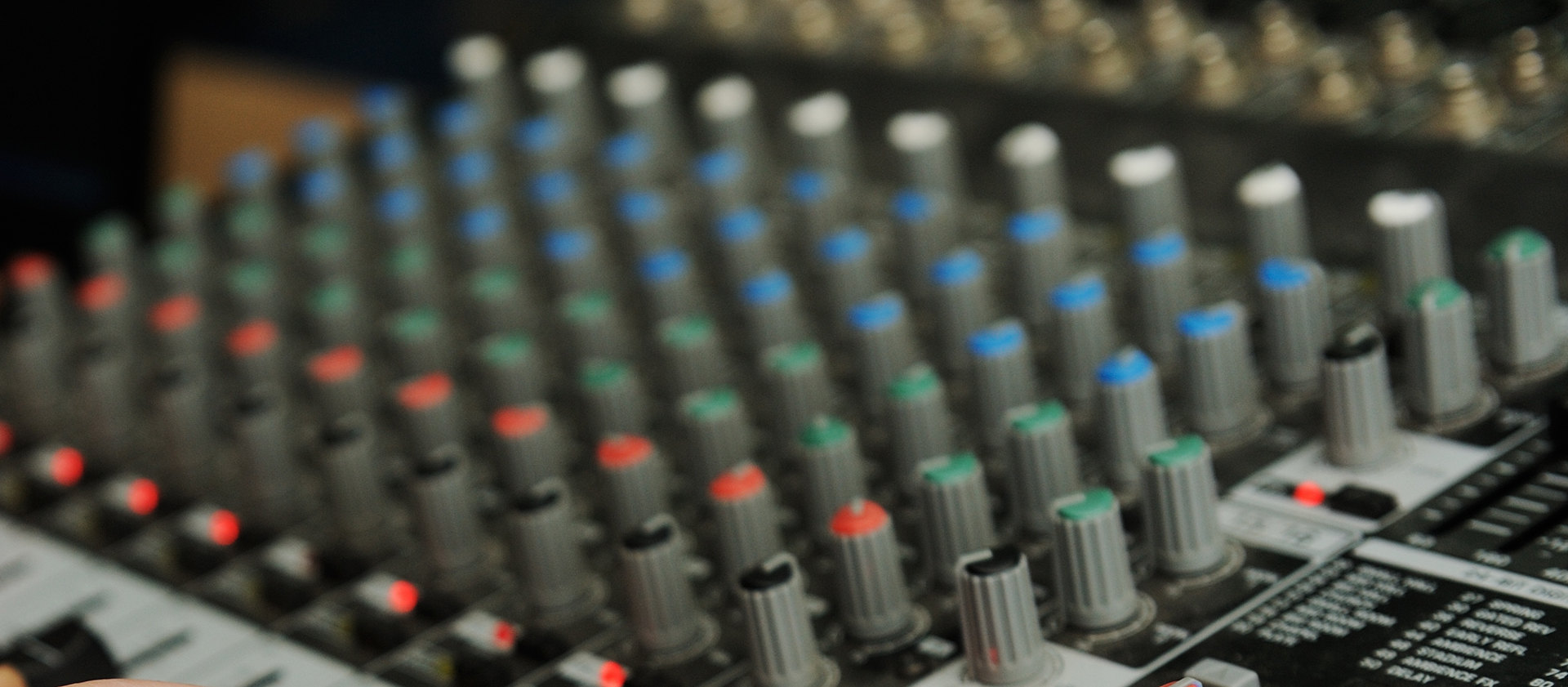 Picture shows audio mixing desk buttons 