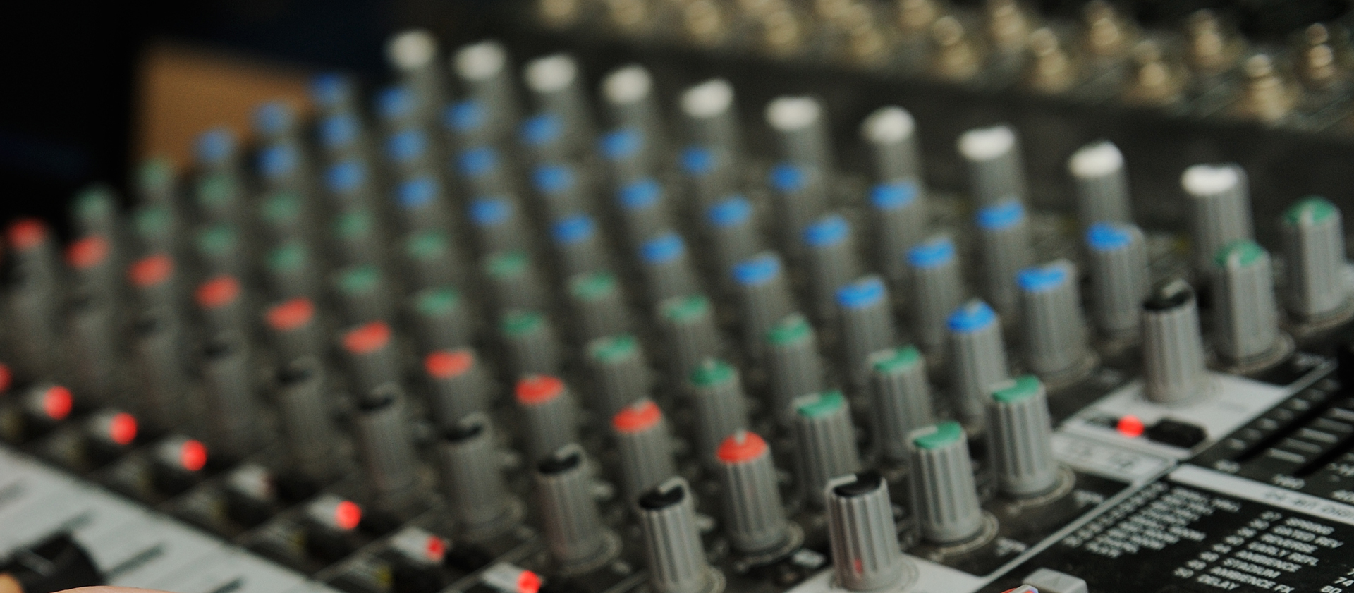 Picture shows audio mixing desk buttons