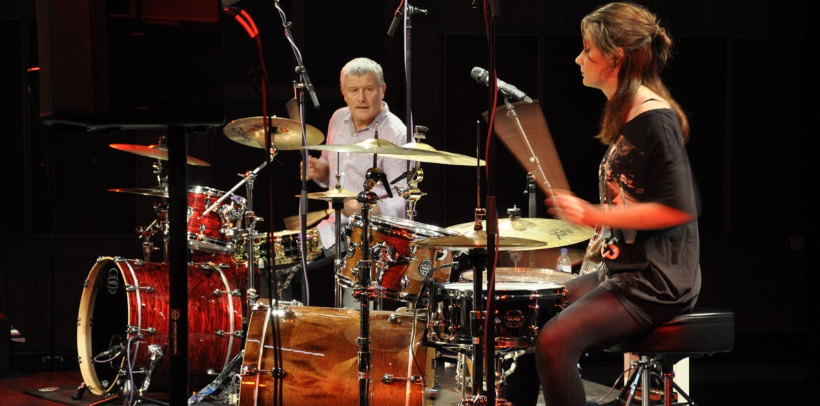Drummer, Carl Palmer during a drumming workshop with a Solent music student