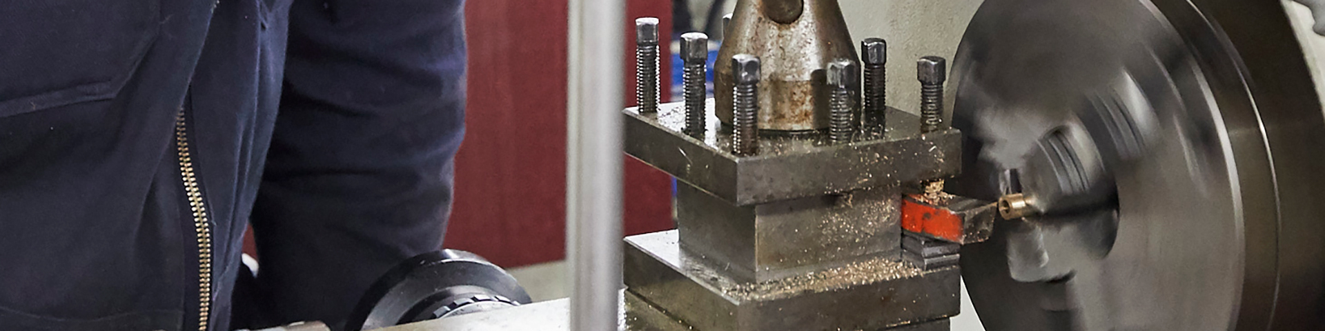 Working on the lathe in our engineering workshops