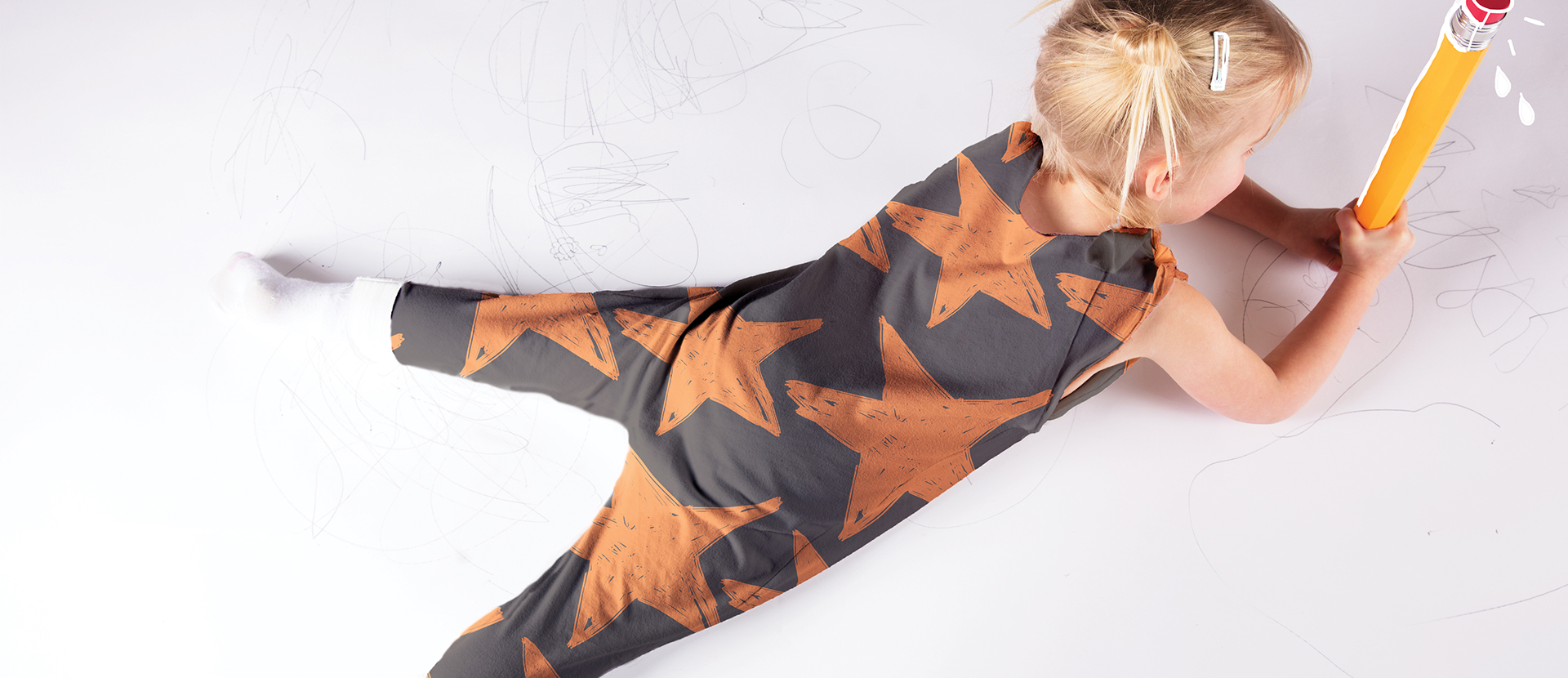 A child model wearing dungarees from Hannah's collection