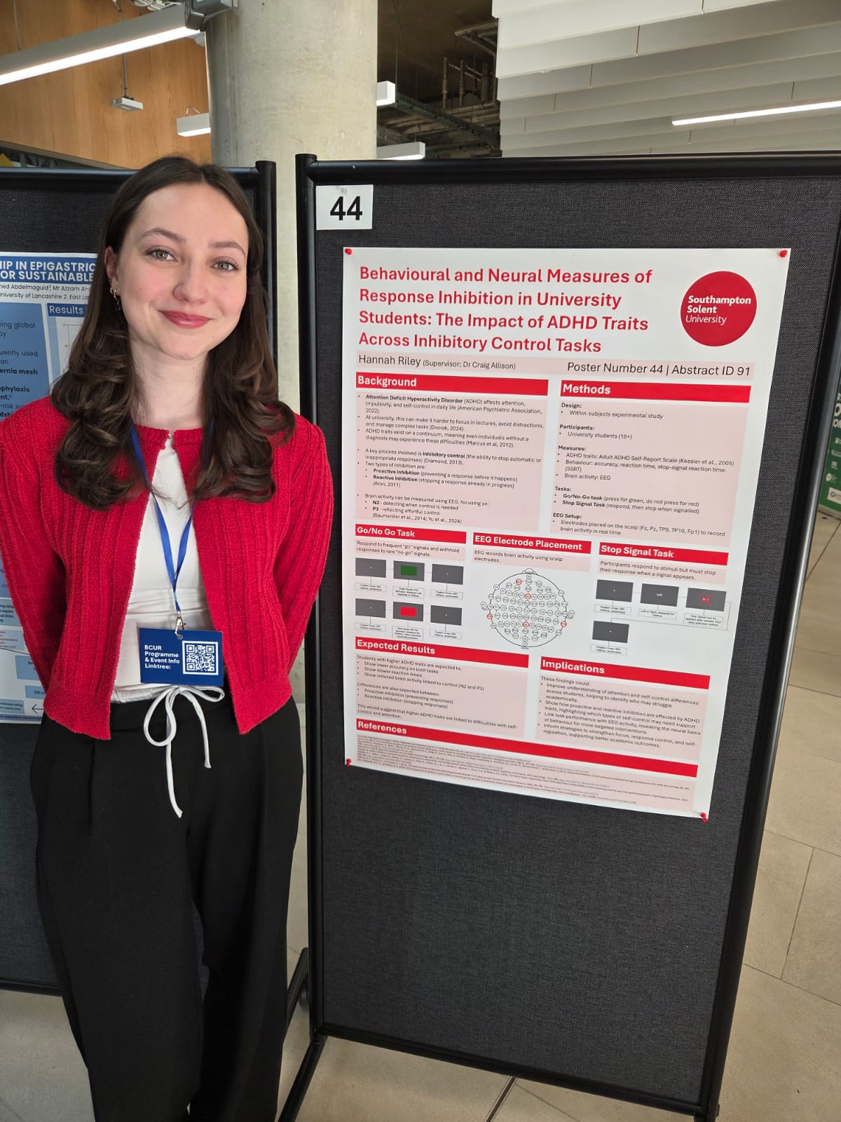 Hannah next to her research project