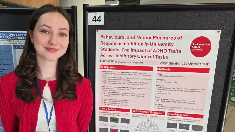 Hannah next to her research project