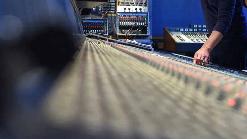 A technician using a mixing desk