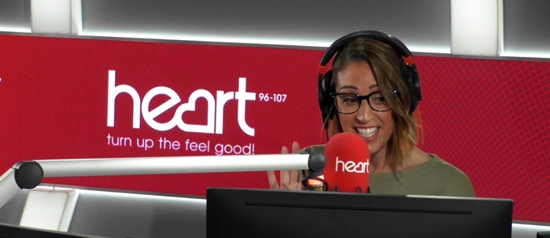 Picture of Solent alumna Rezzy Ghadjar presenting on Heart radio in the national studio