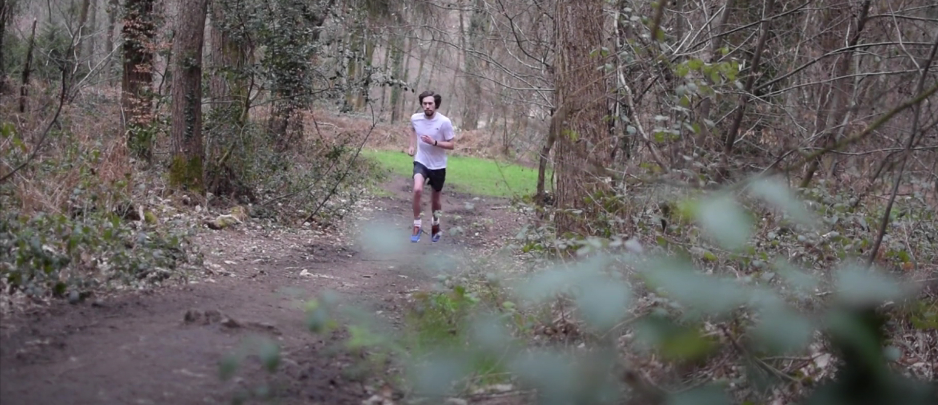 image of jesse running in the woods