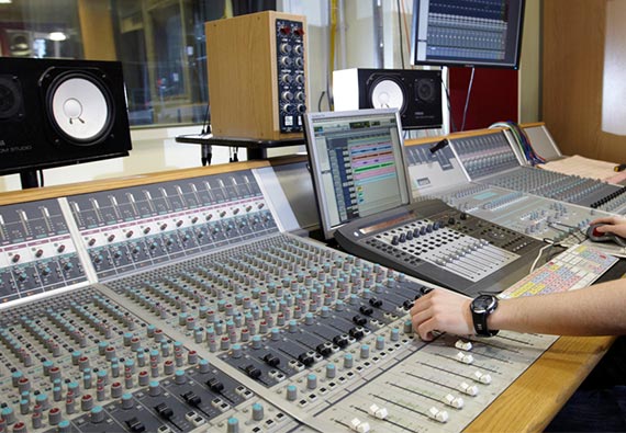 A sound board mixing desk in a recording studio