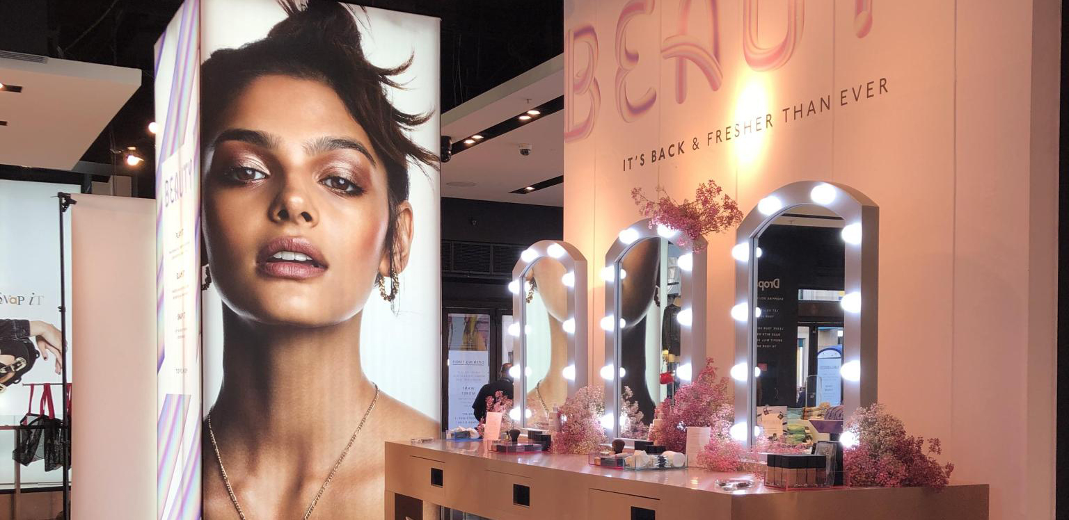 Image shows Topshop beauty area in-store 