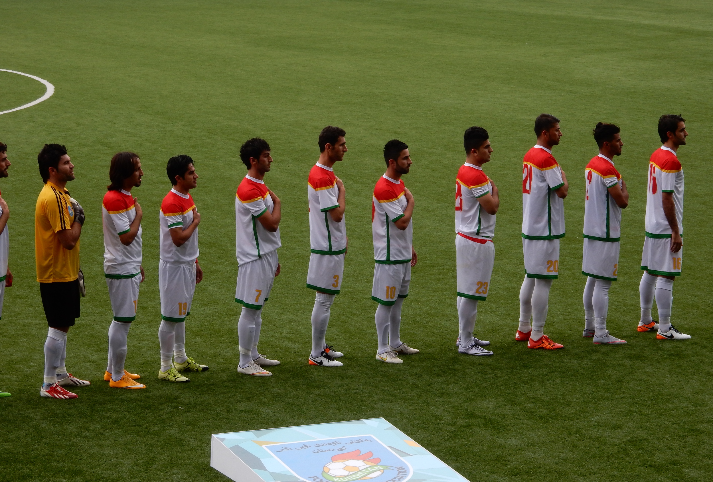 Kurdistan's football team at the playing of the national anthem