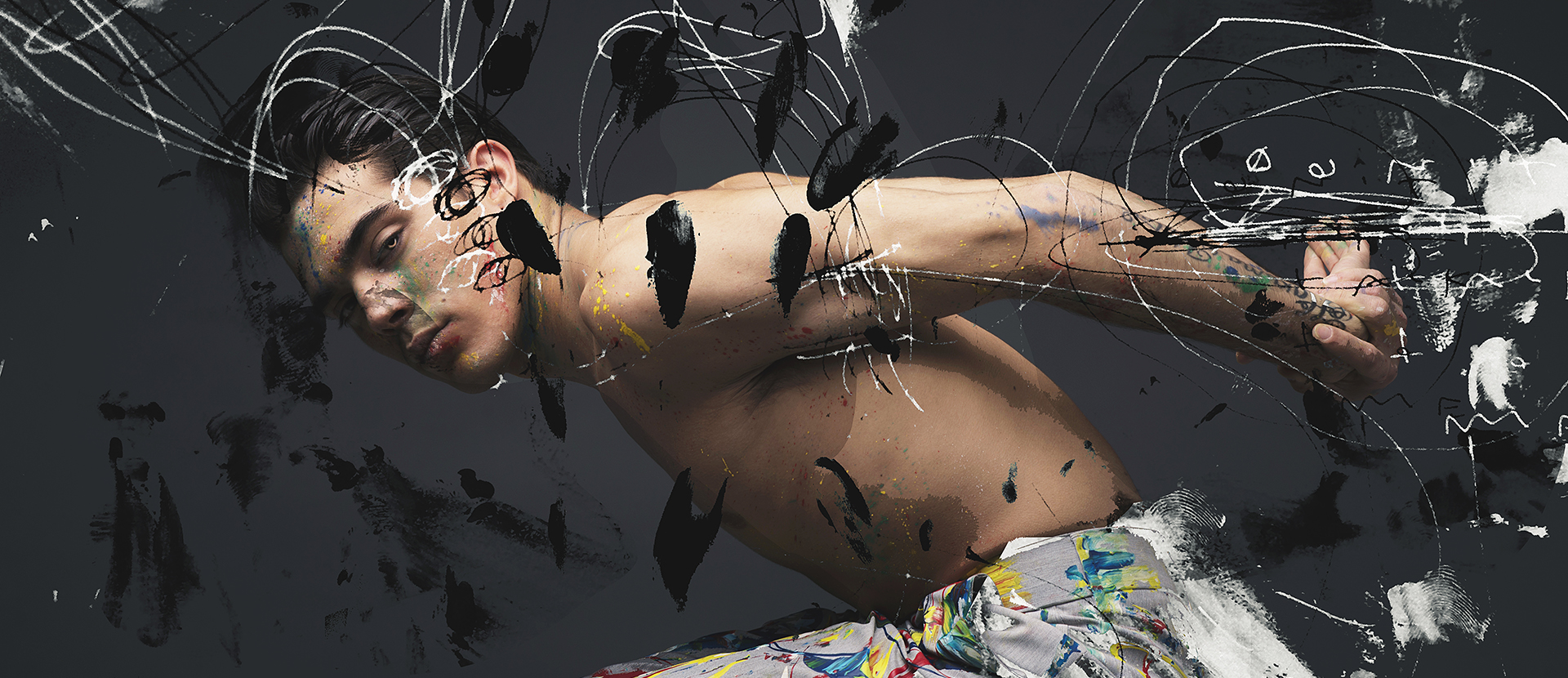 A male model posing with his hands behind his back