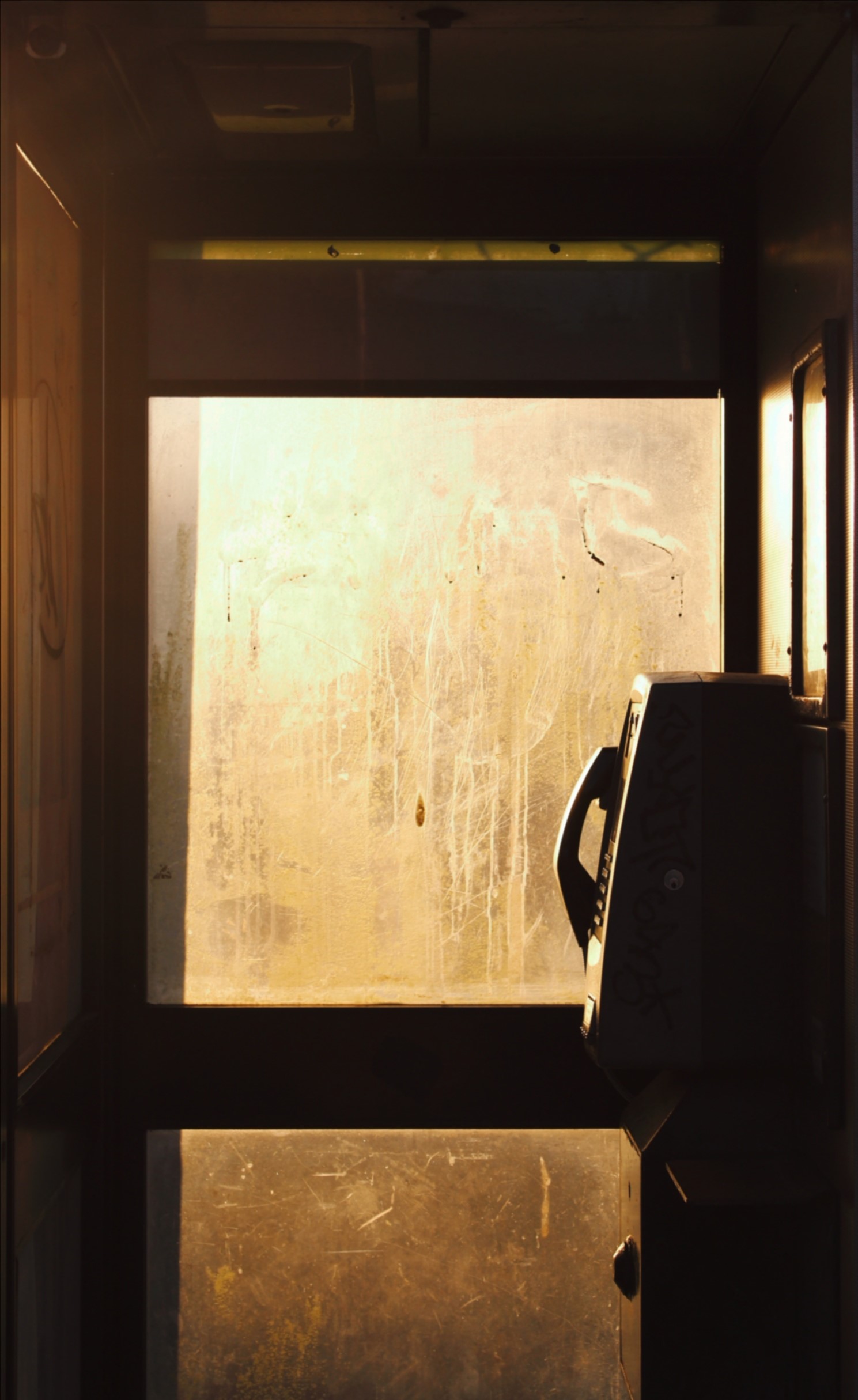 Katherine's image shows phonebox with dusky Autumn light shining through