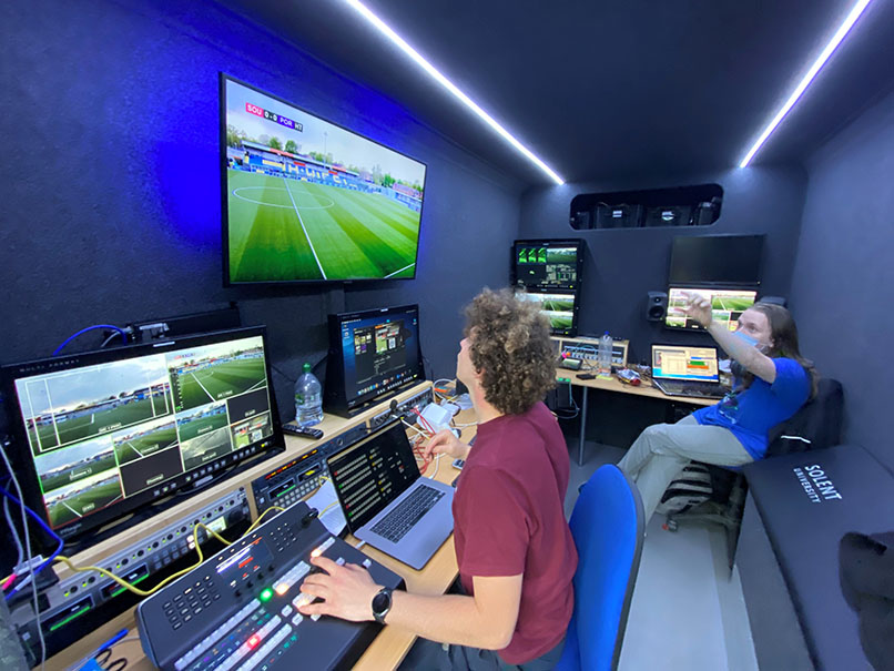 image of students working in outside broadcast vehicle vision mixing the football match