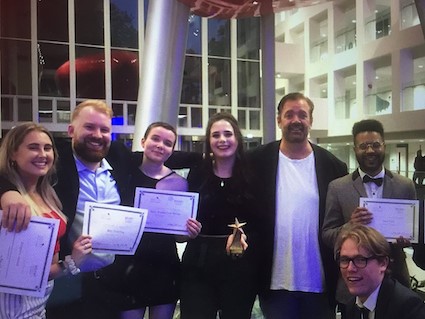 Picture of Stephen Desmond celebrating with students at the annual STAR film awards 