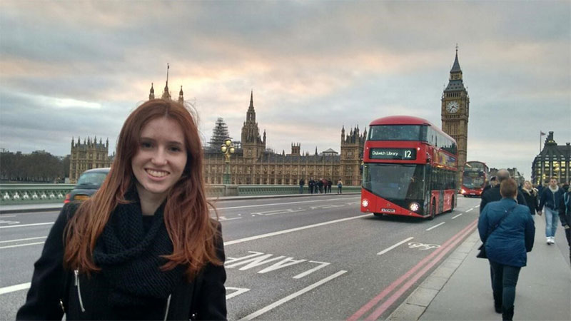 virginia Rarra standing in front of the Houses of Parliament