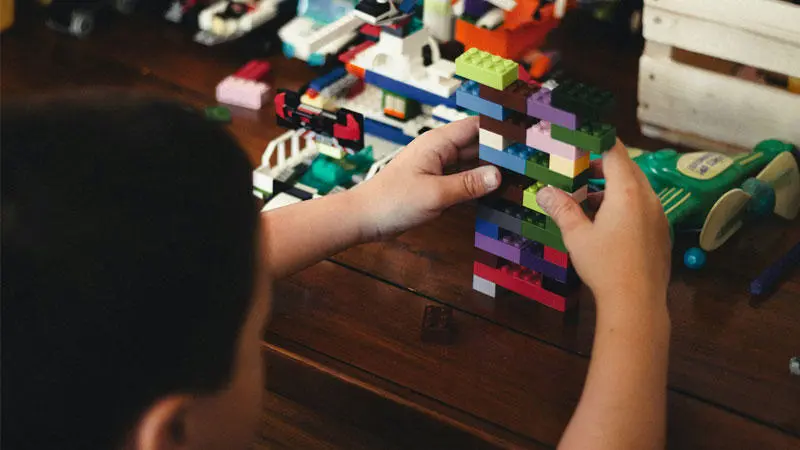 A child playing with Lego