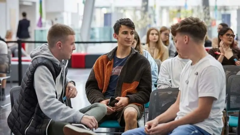 A group of students discussing