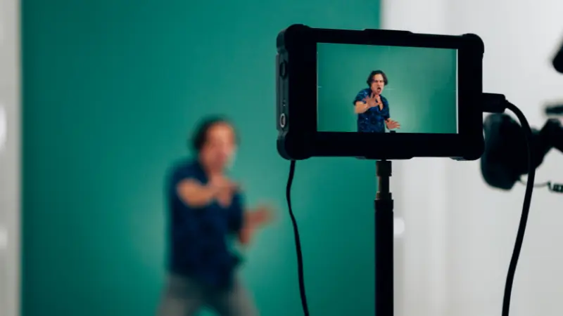 A man acting in front of a camera