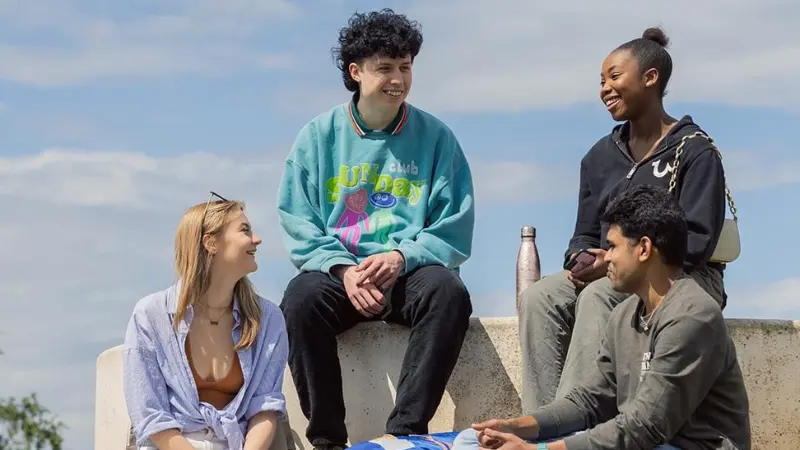 A group of friends sat talking