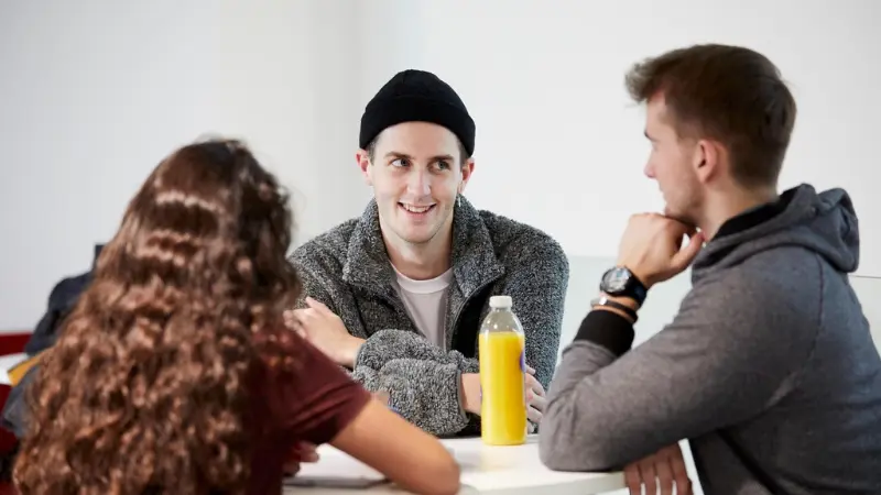 A group of friends sat talking