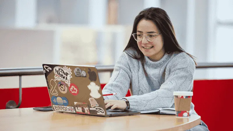 A female student working on a laptop
