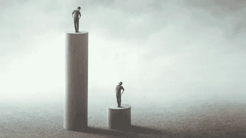 An image that represents social inequality with two people on different podiums