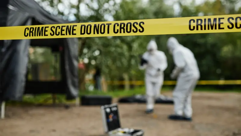 A crime scene marked off by crime tape