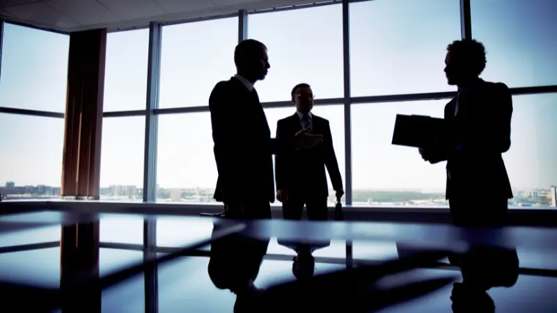 A group of business men talking