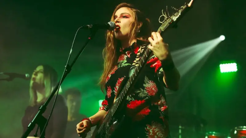 A singer performing on a stage