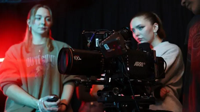 Two students using a camera