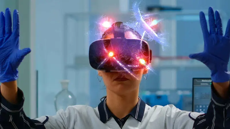 medical woman wearing a VR mask and blue gloves
