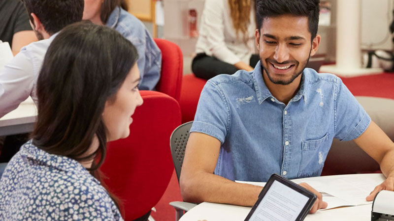 A group of students working together in the library