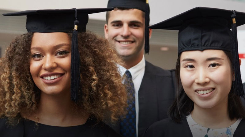 A group of Solent graduates wearing gowns and mortar boards