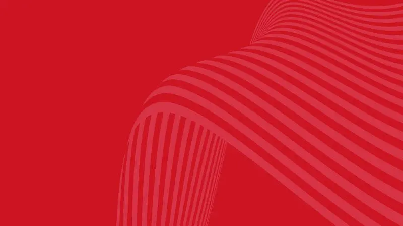 A wave motif on a red background