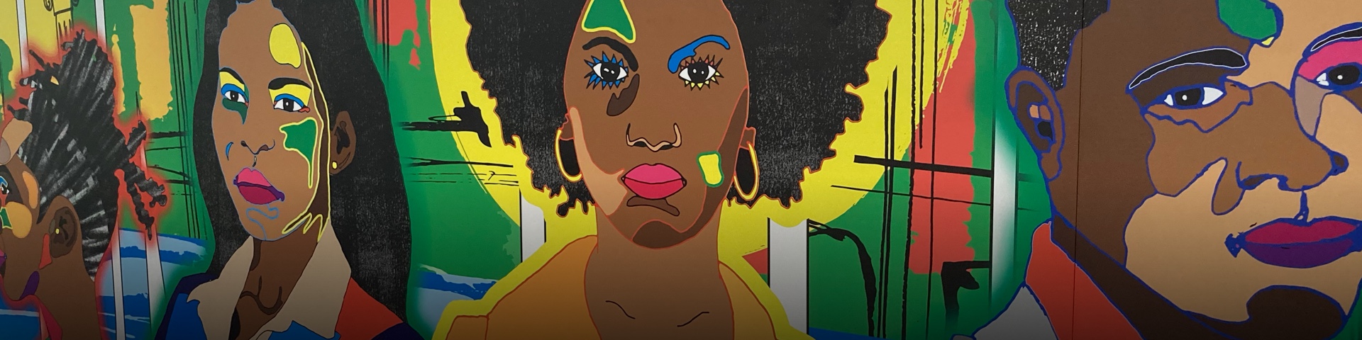 A colourful mural of two women and a man's face.