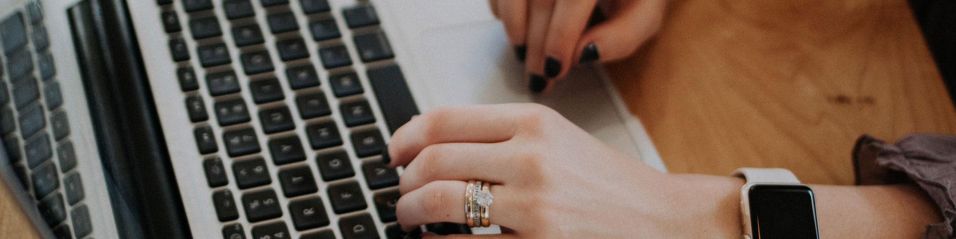 A person typing on a laptop